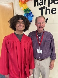 peopole dressed in graduation caps and gowns