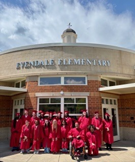 peopole dressed in graduation caps and gowns
