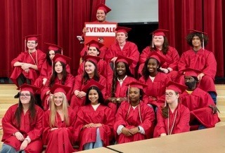 peopole dressed in graduation caps and gowns
