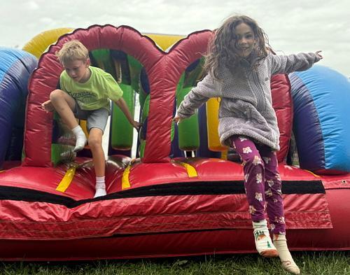 students standing in front of an inflatable structure