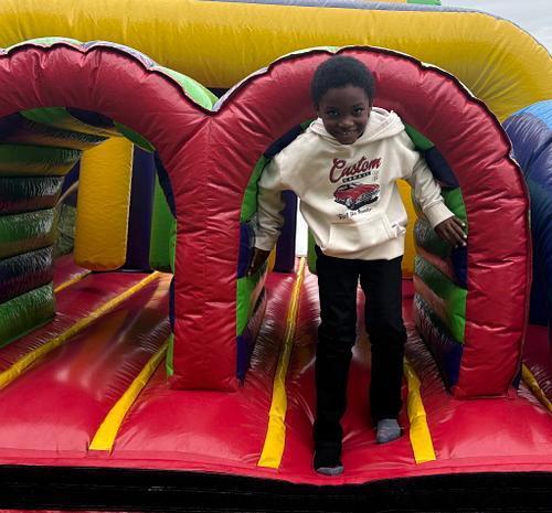 students standing in front of an inflatable structure