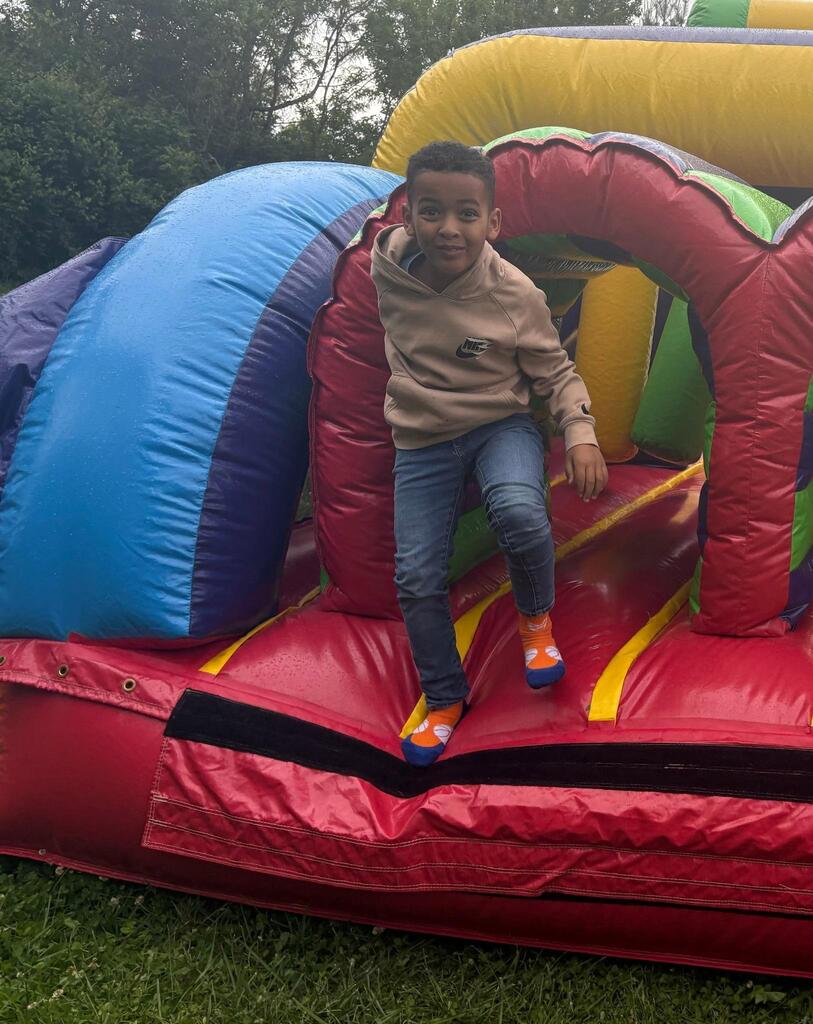 students standing in front of an inflatable structure