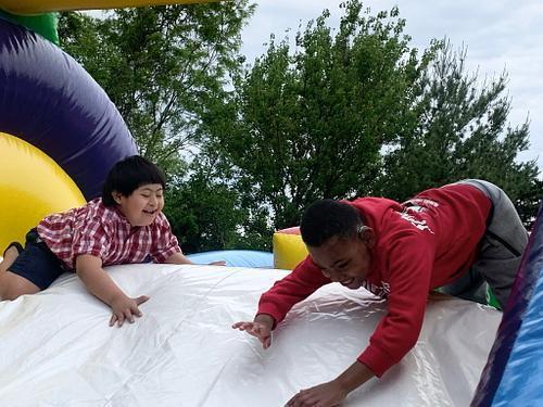 students standing in front of an inflatable structure
