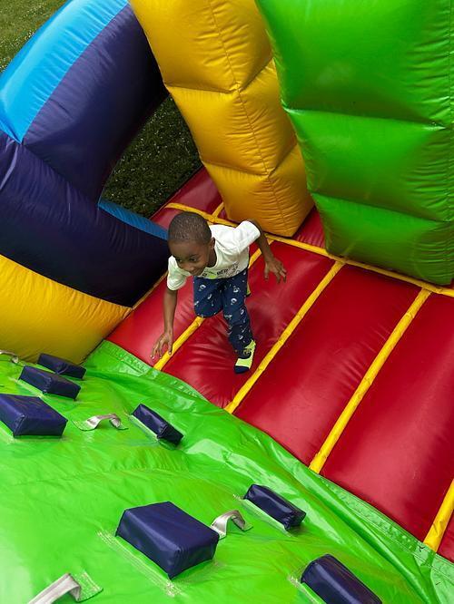 students standing in front of an inflatable structure