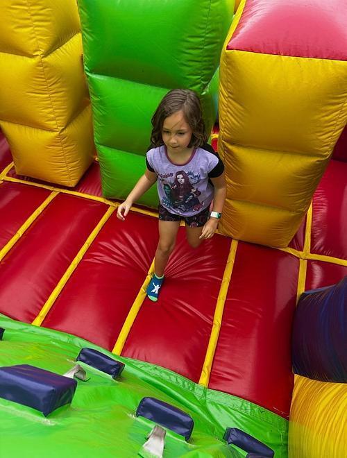 students standing in front of an inflatable structure