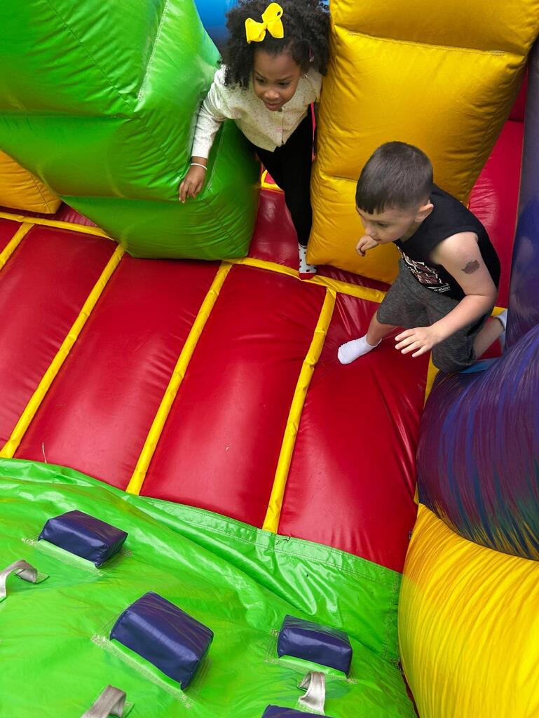 students standing in front of an inflatable structure