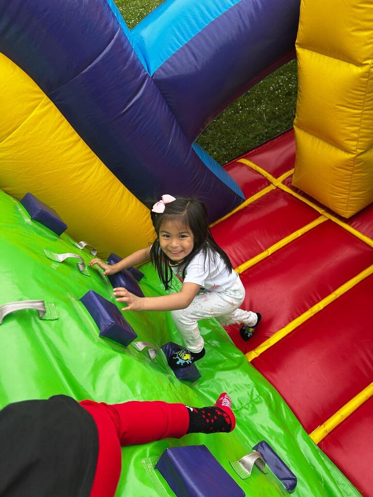 students standing in front of an inflatable structure