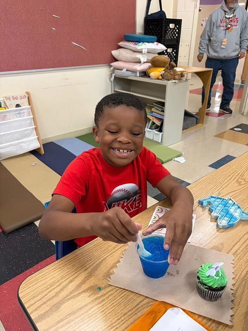 person with a table and sweet treats 