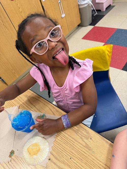 person with a table and sweet treats 