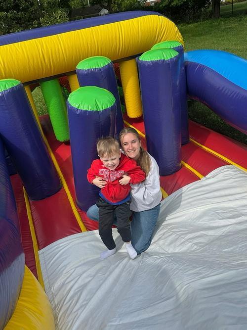 person sitting on a bouncy house