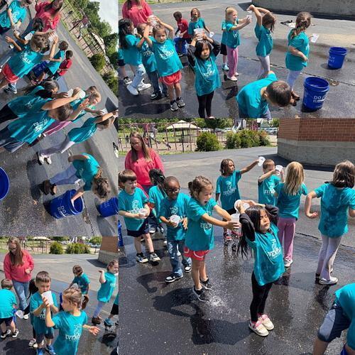people in matching shirt with water activities