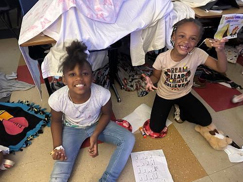 people in a classroom holding some smores 