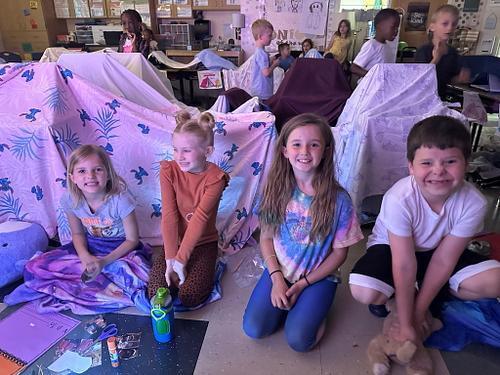 people in a classroom holding some smores 