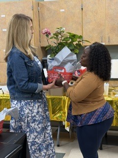 person handing another person a gift