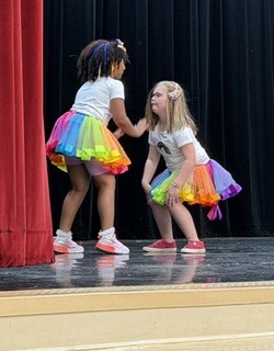 people in colorful outfits on a stage