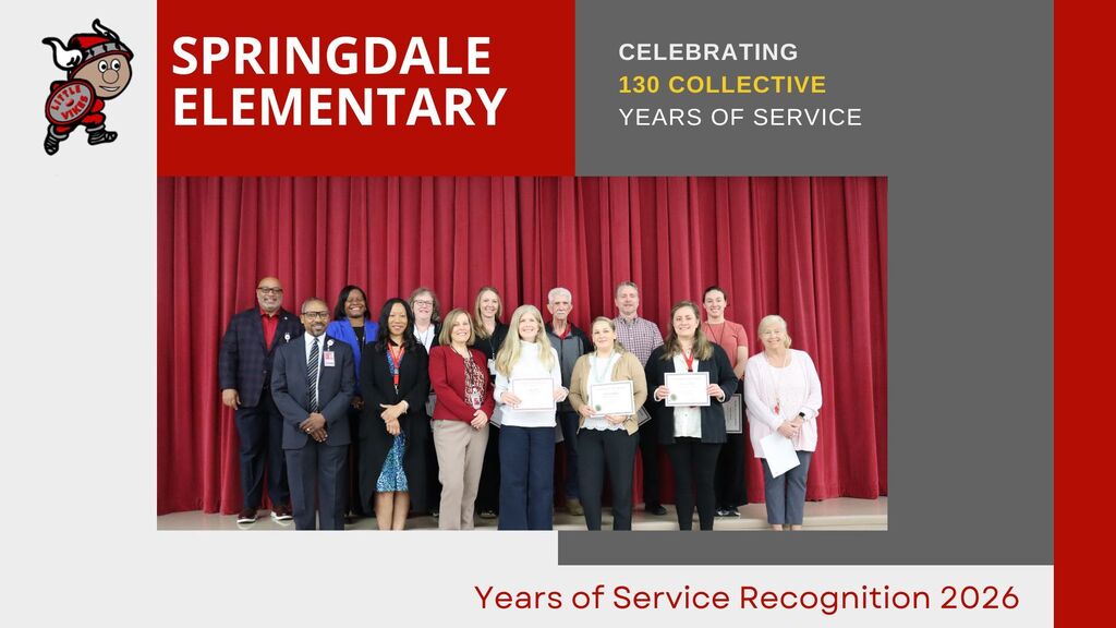 A group of Springdale Elementary staff stand in front of a red curtain holding certificates, celebrating 130 collective years of service in 2026.