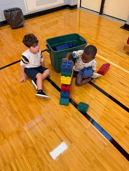 students in the gymnasium with blocks