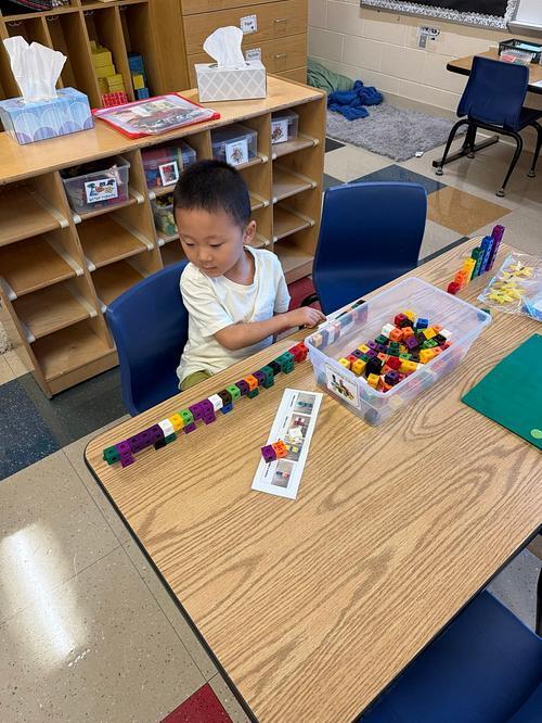 student playing with cubes