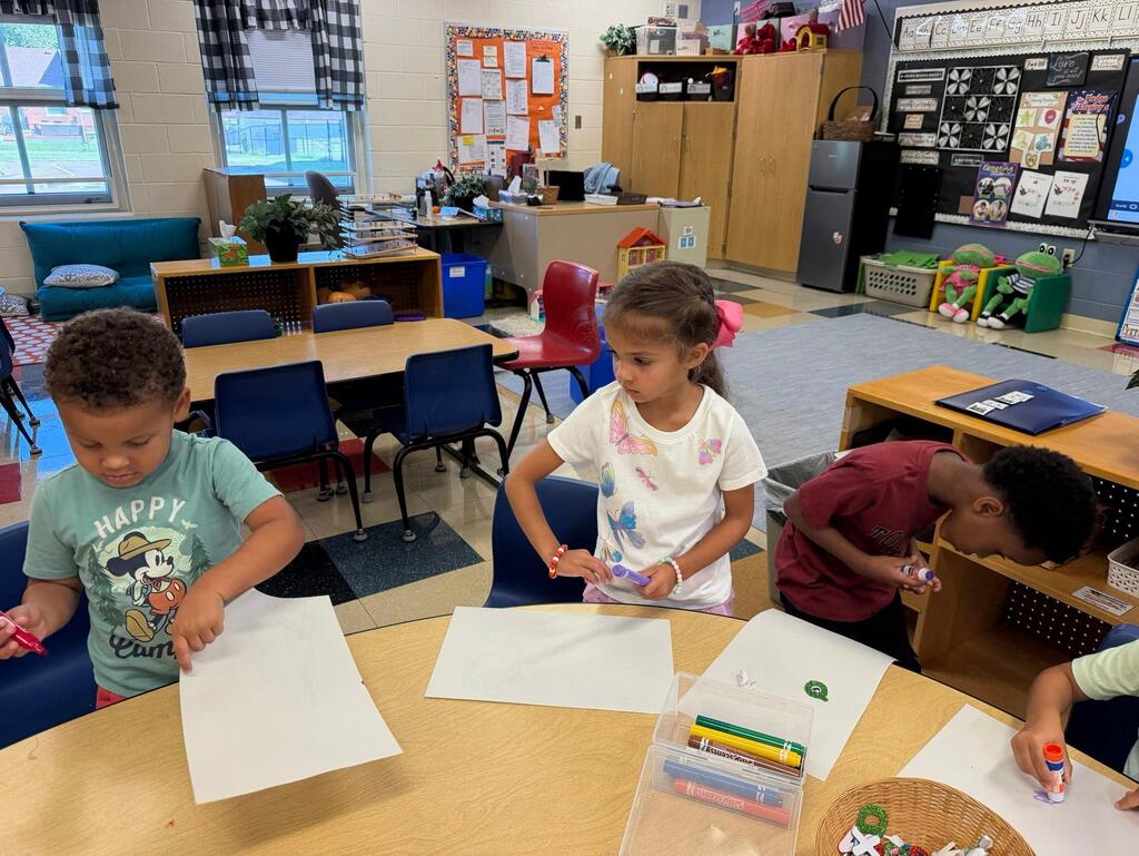 two students using paper