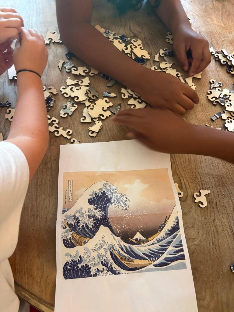students working with puzzle pieces