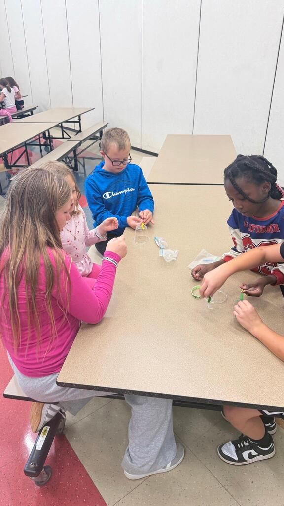 students working at a table in the cafeteria