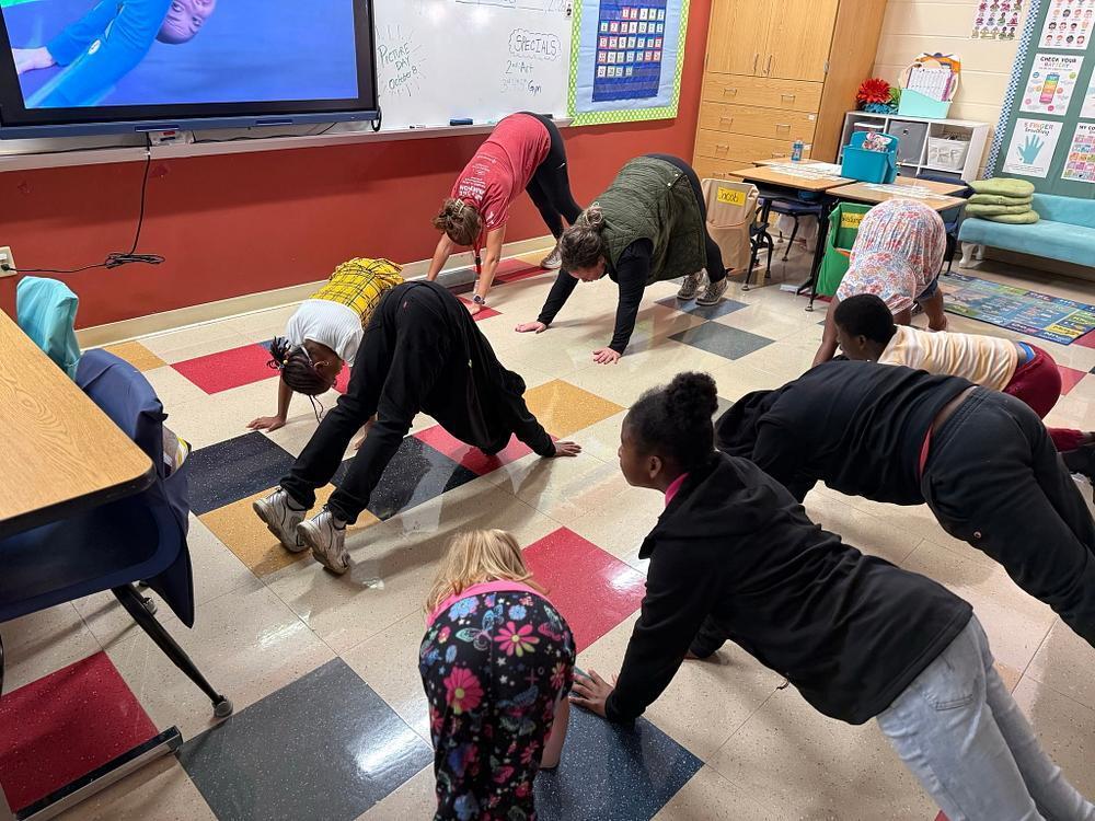 people doing yoga poses