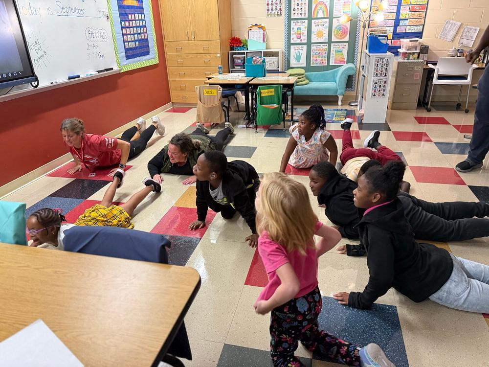 people doing yoga poses