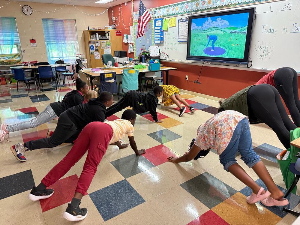 people doing yoga poses