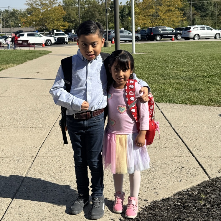 siblings grades 1 and 3 smiling on fall picture day 2026