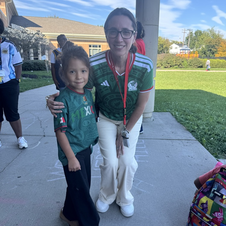 principal Lastra and kinder student in matching jerseys sports day HH October 2026