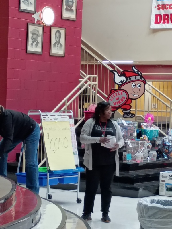 Teacher drawing the winners for the prizes