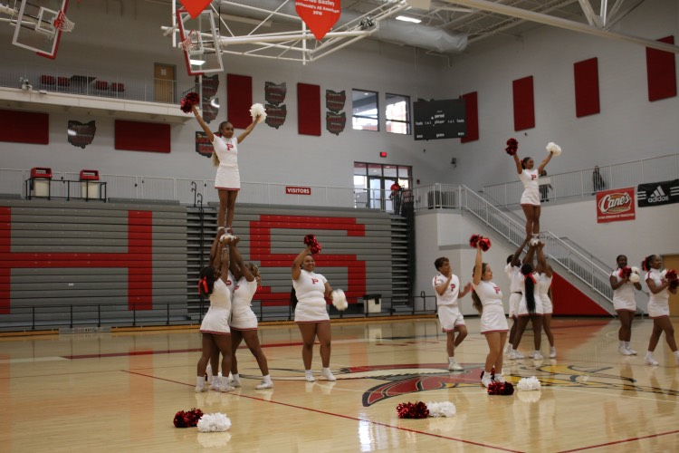 Princeton cheerleaders performing in the Viking Arena