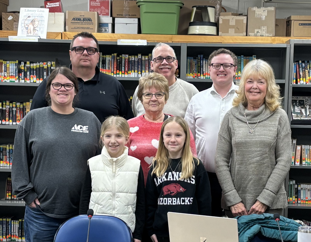 PES School board pictured with December and January Student Spotlight selections