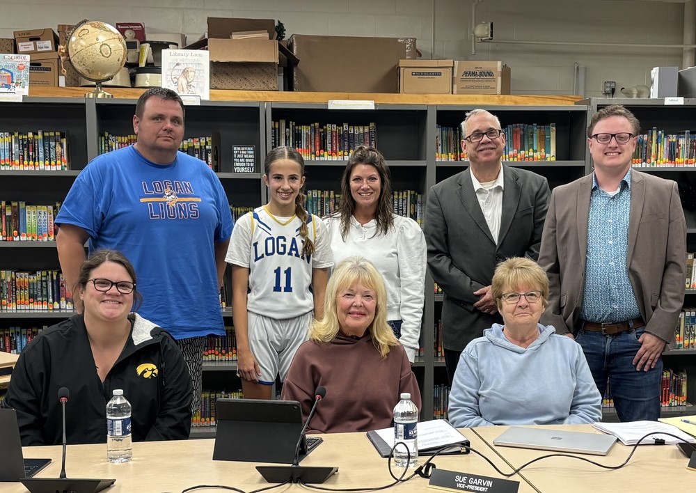 Members of the PES school board and October student of the month, Maycie Munson