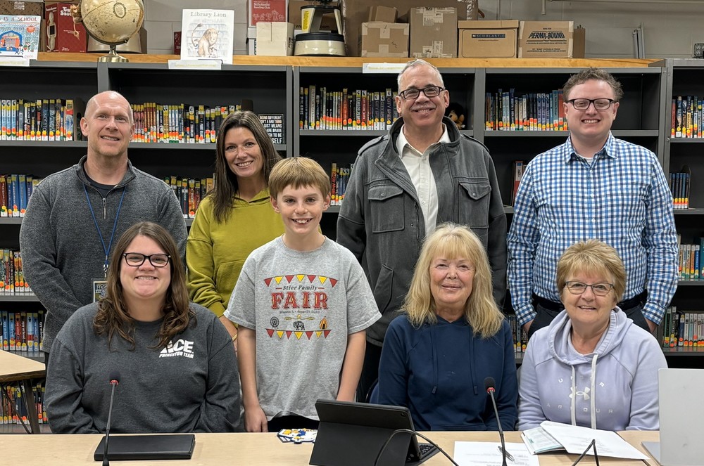 Members of PES school board with November student of the month, Eli Smith