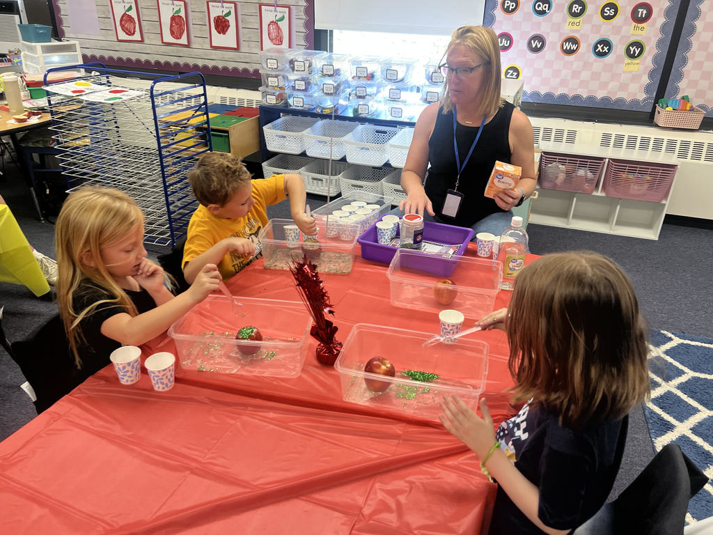 Douglas Kindergarten students decorating apples for Apple Day