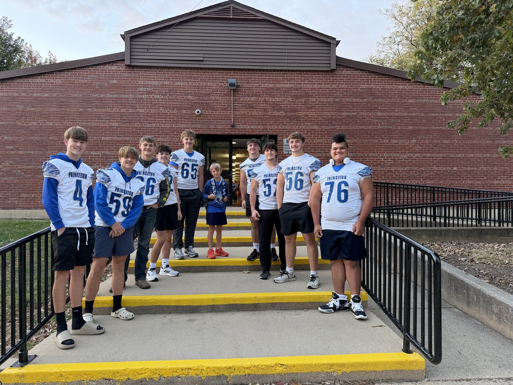 Members of the PHS Football team greating students on Friday