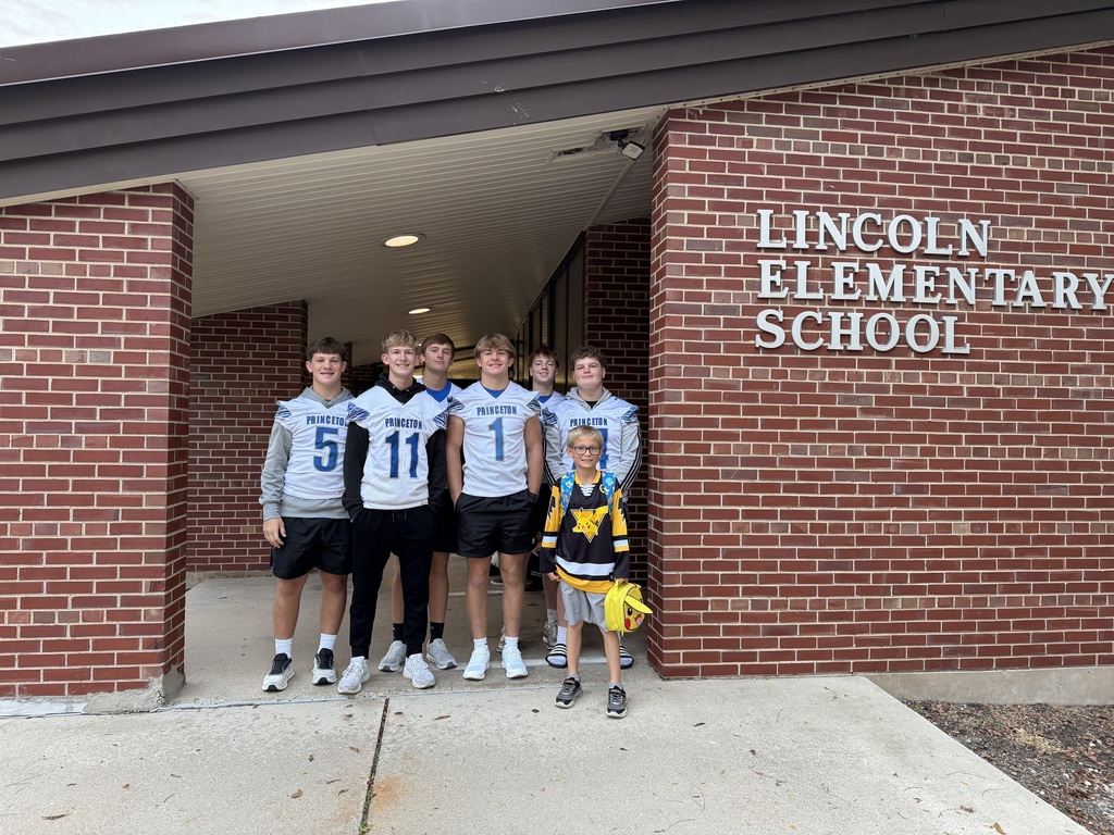Members of the PHS Football team greating students on Friday