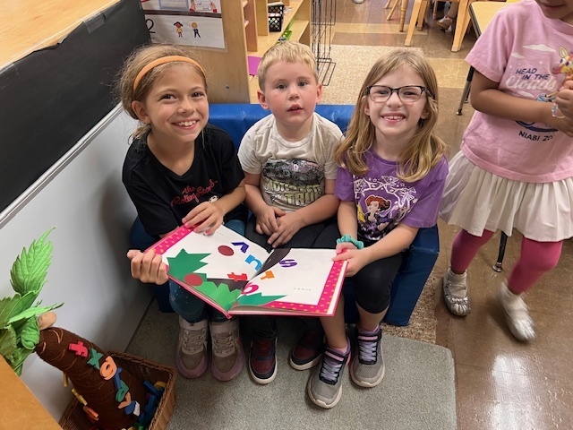 Members of Mrs. Thompson's third grade class visiting Douglas Elementary Preschoolers