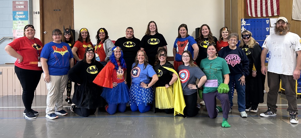 Douglas staff dressed up as Super Heroes for Halloween