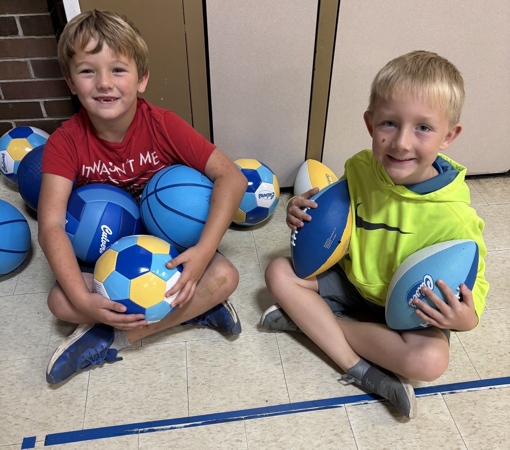 Two Jefferson students with balls obtained from Culver's using Scoopie Tickets
