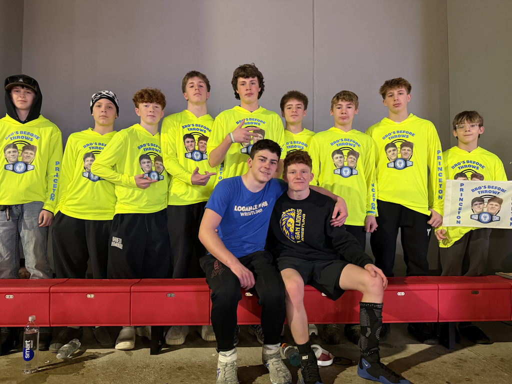 Wrestler's Hawk Amy and Eric Giaquinto pictured with their crew at the State Wrestling Meet.