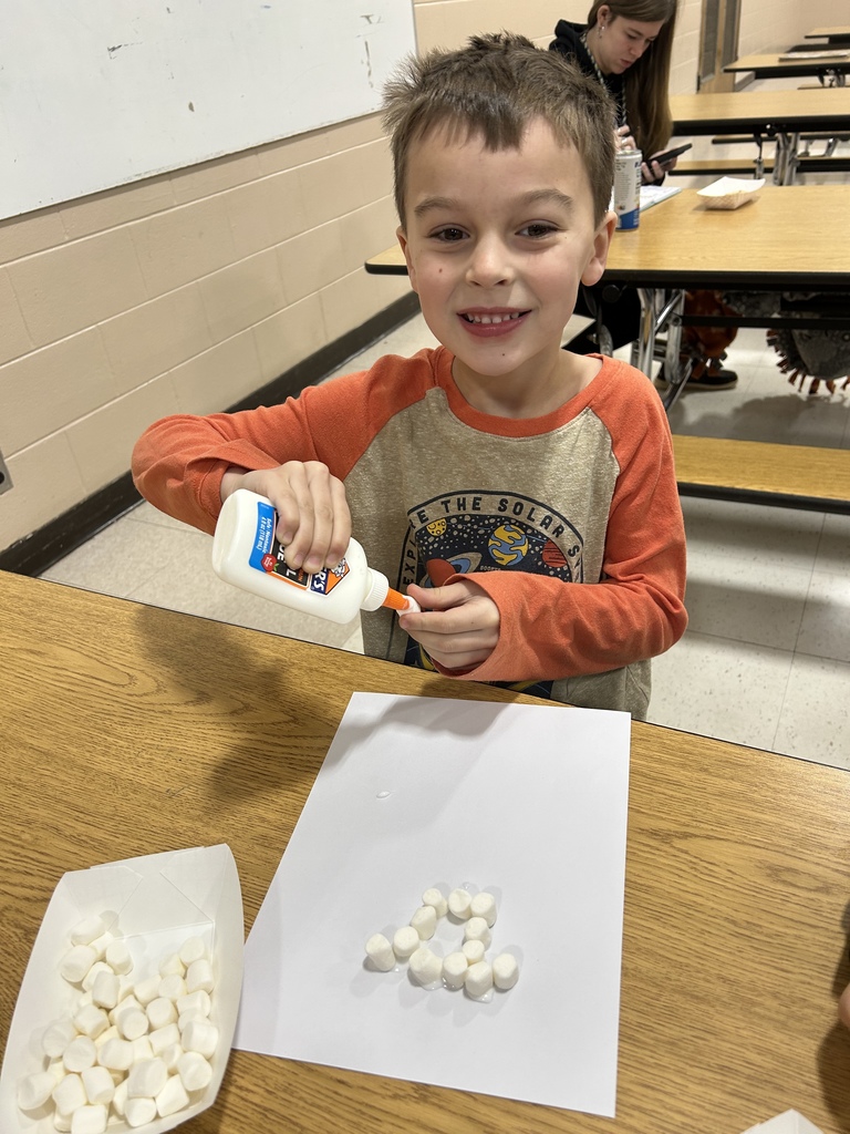 Boy making Marshmellow Snowman