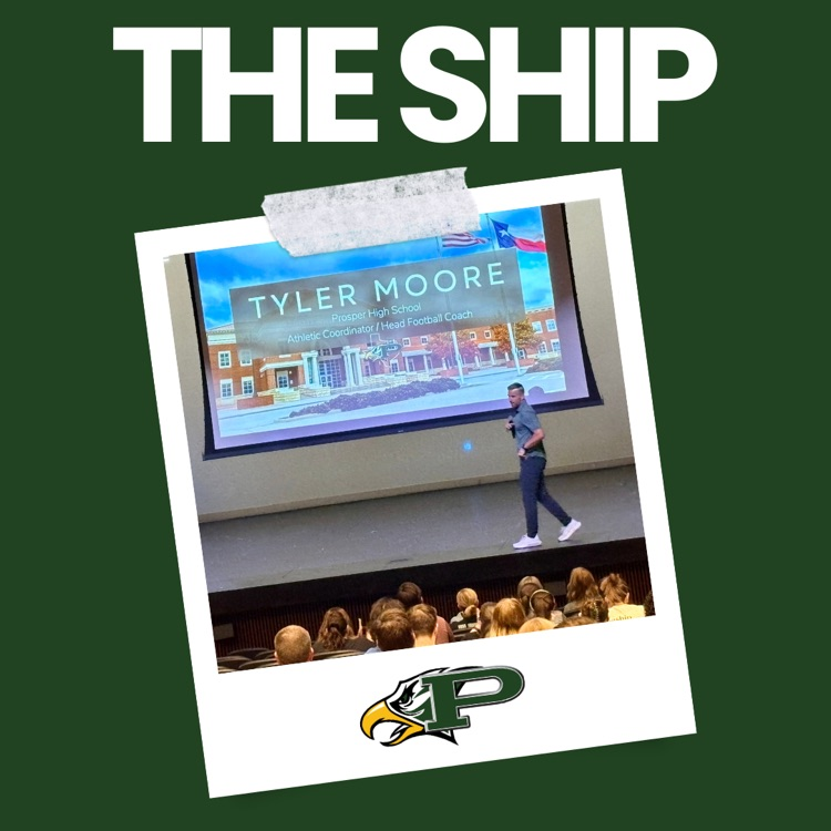 Photo of Prosper High School Head Football Coach and Athletic Coordinator Tyler Moore speaking to staff in an auditorium. A large screen behind him displays his name and title, with the PHS logo and “The Ship” graphic above the photo.