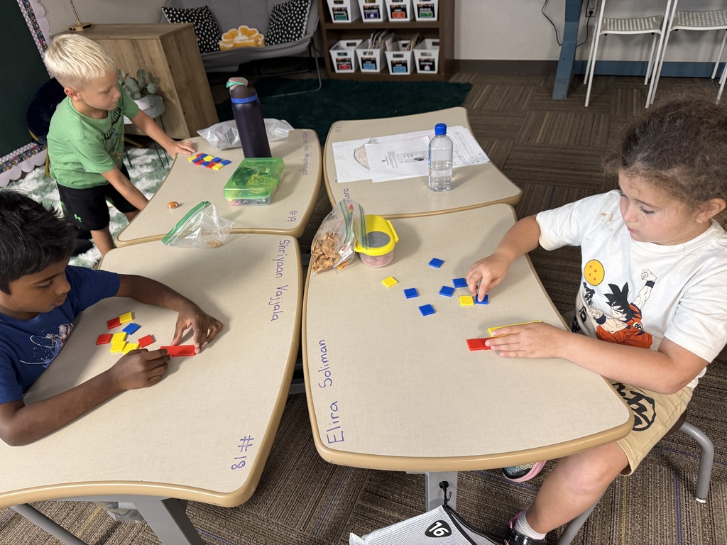 First graders working on graphing.