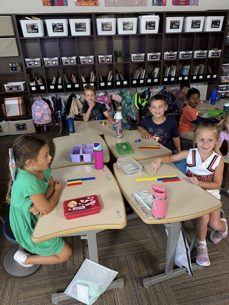 First graders working on graphing.