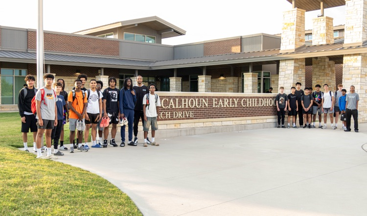 Rock Hill HS Boys Basketball Teams volunteer in the Calhoun ECS car line