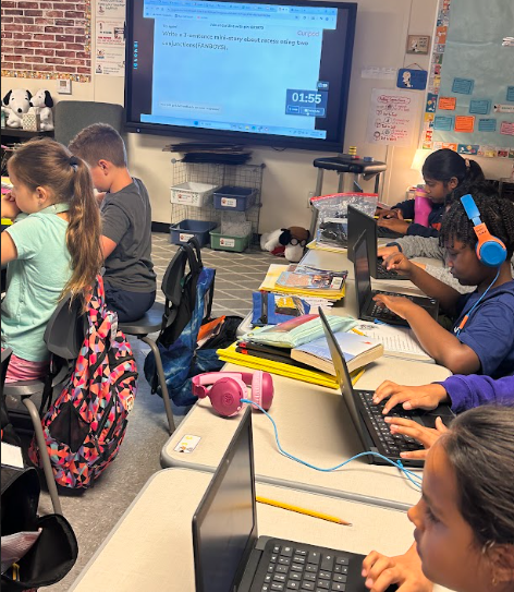 Fourth Graders working on Curipod and Sacred Reading
