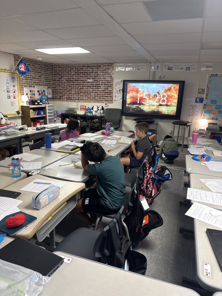 Fourth Graders working on Curipod and Sacred Reading