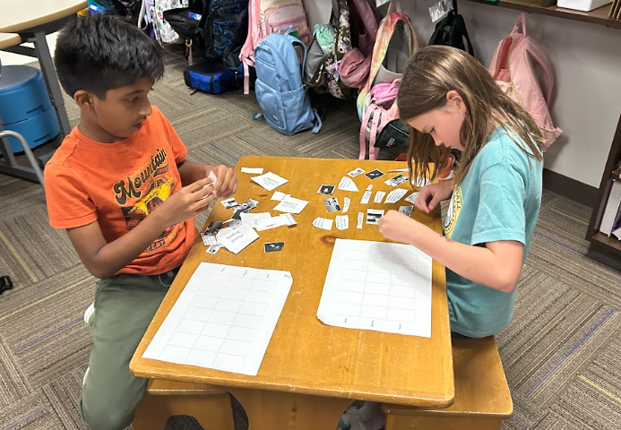 Third Graders  working with partners on matter vocabulary by matching words, definitions and images.